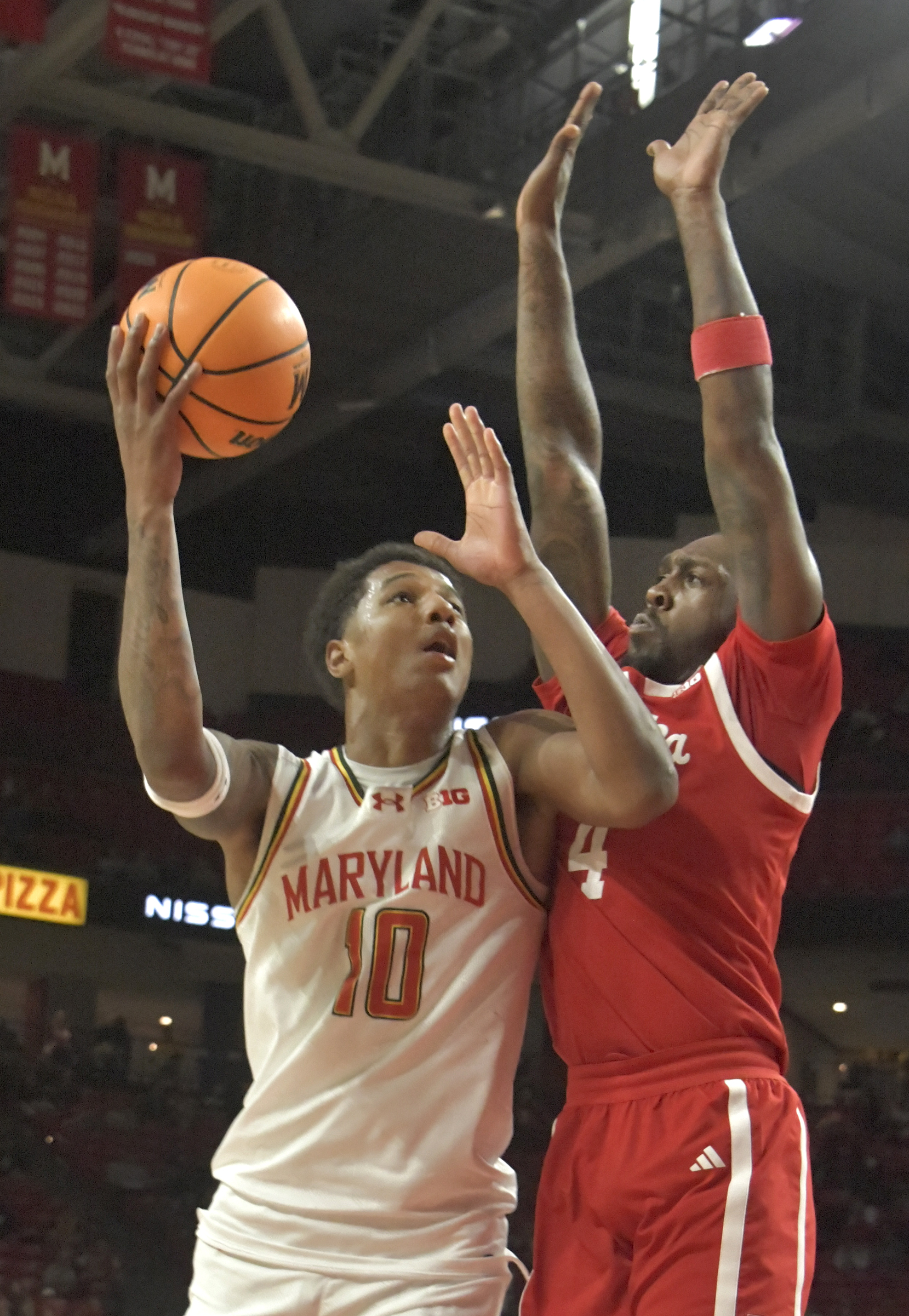 Maryland's Julian Reese #10 shoots in front of Nebraska forward Juwan Gary #4. The Terps pulled out the win over the Cornhuskers, 69 - 66. (Amy Davis/Staff)
