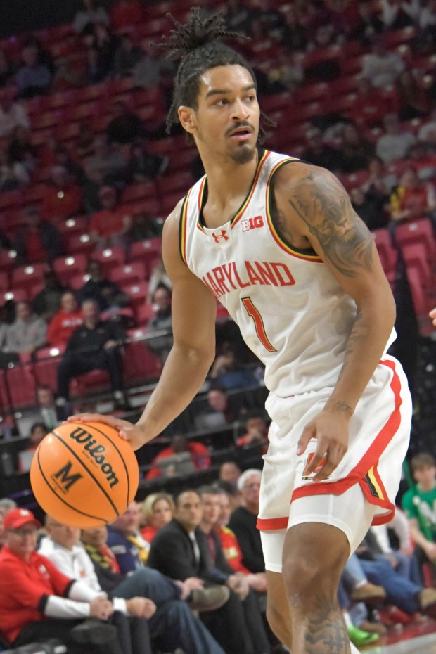 Maryland guard Rodney Rice #1 looks for an opening in a close game against Nebraska. The Terps beat the Cornhuskers, 69 - 66. (Amy Davis/Staff)