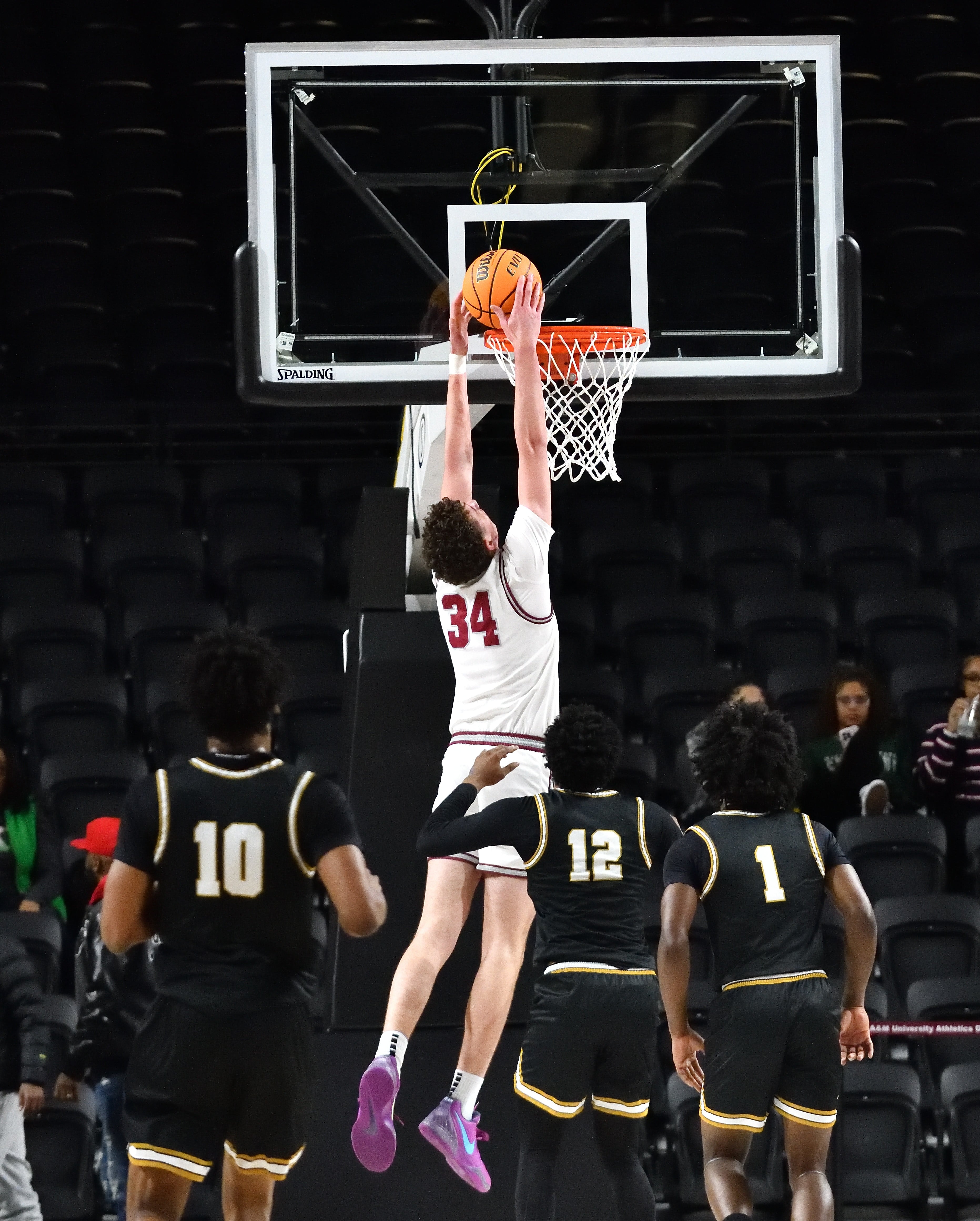 Huntsville High School Evan Toms with a dunk against Oxford High School in the 2025 Rocket City Braggin’ Rights at Alabama A&M University Event Center Normal, Al. Monday, Jan. 20, 2025. (Kevin Farrell | preps@al.com).