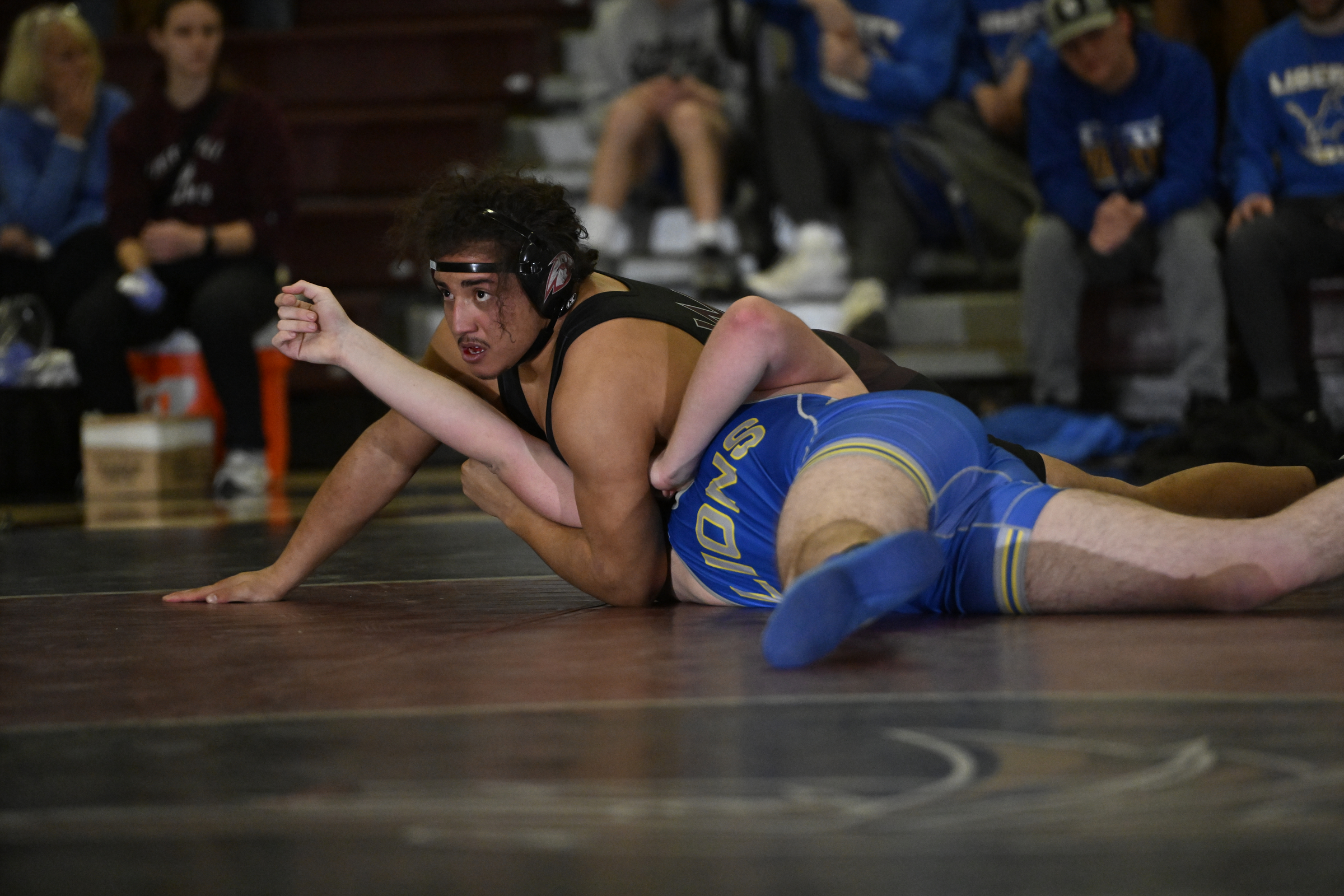 Winters Mill's Victor Tejada looks to pin Liberty's Renner O'Brein...