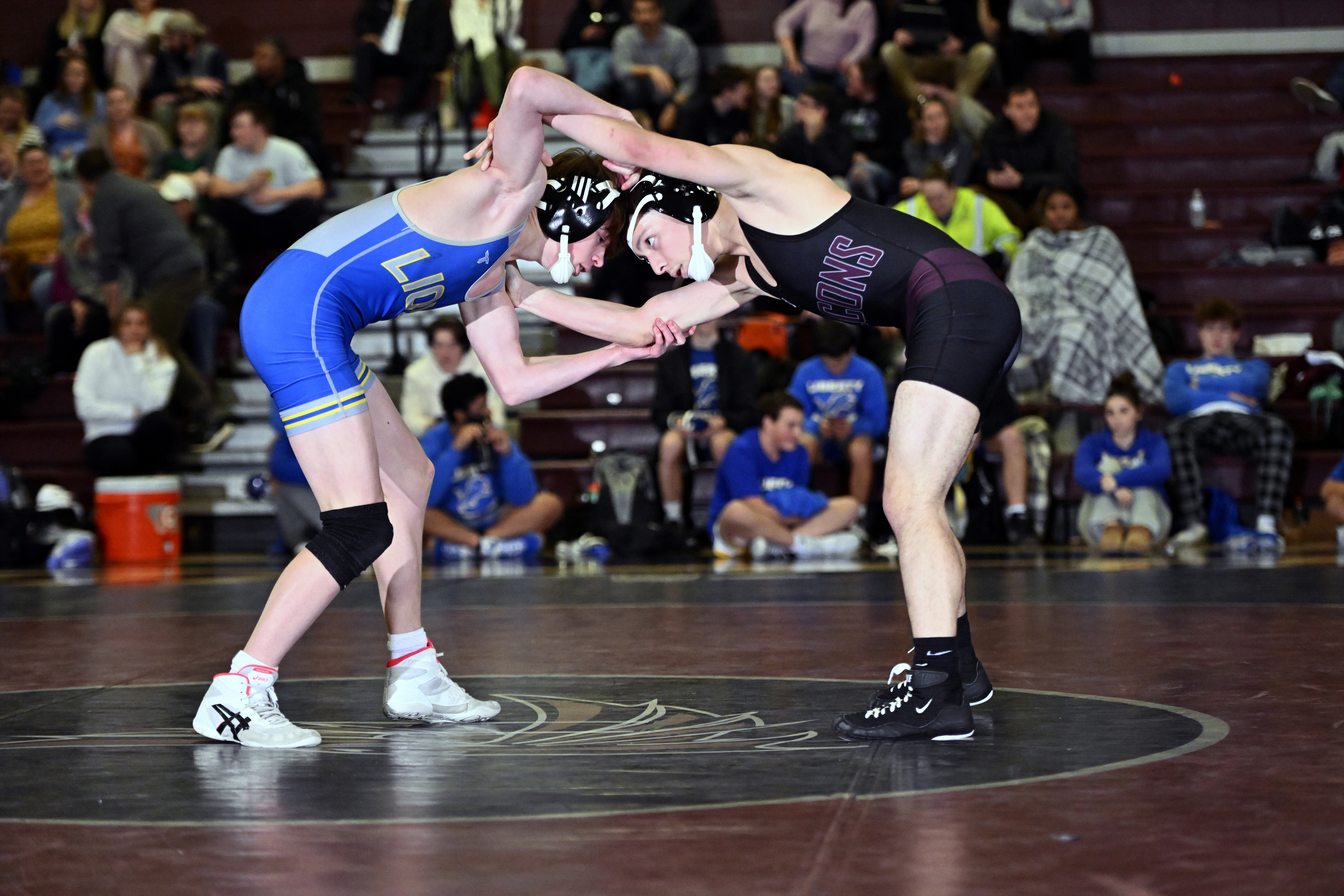 Winters Mill's Lazarus Munson and Liberty's Josh Moore tangle during...