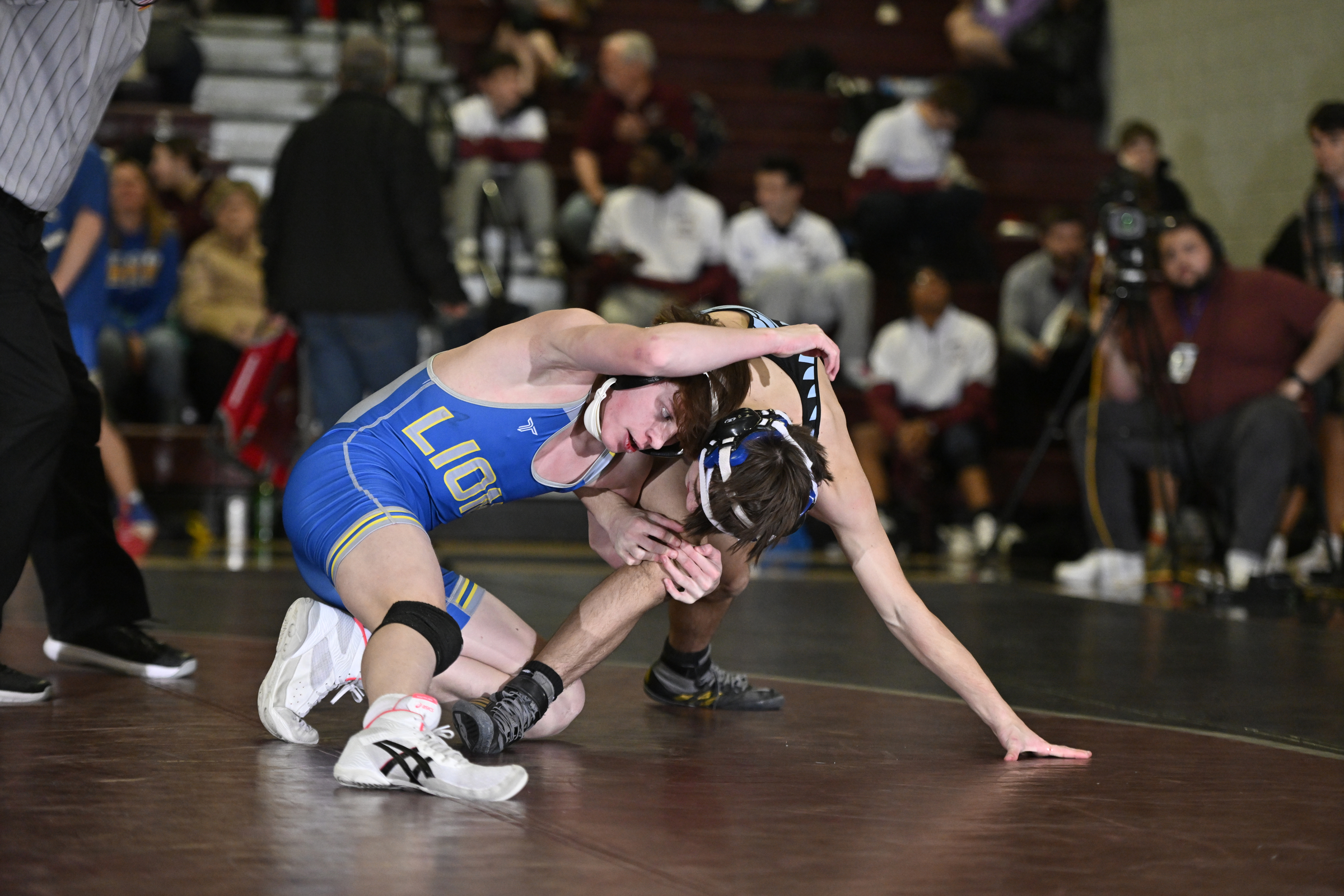 Liberty's Josh Moore tries to take down Westminster's Adam Shaffer...