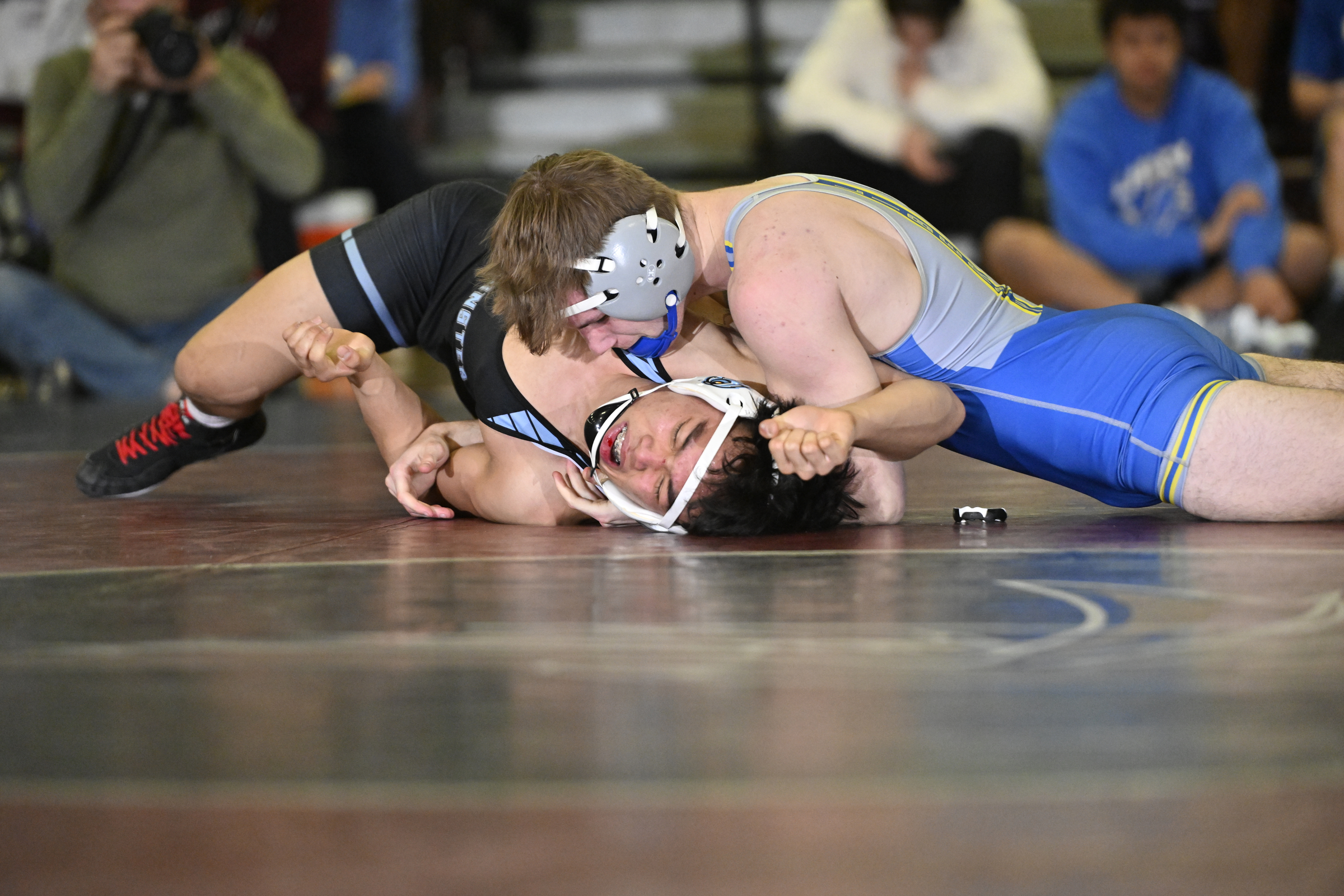 Liberty's Jared Peik scores back points on Westminster's Ethan Degalicia...