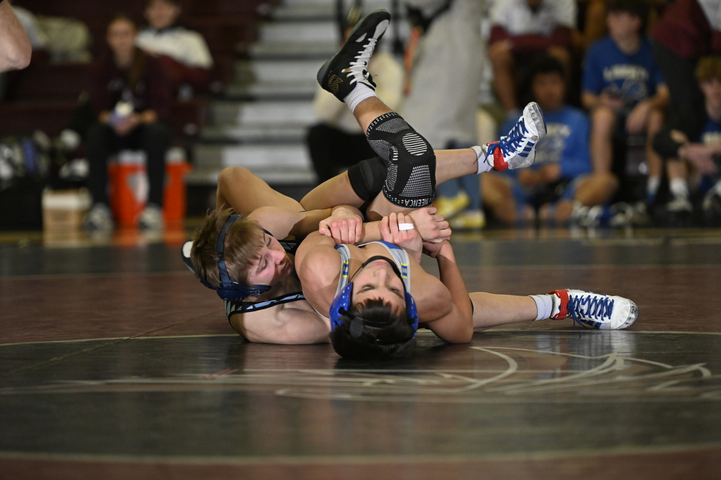 Westminster's Jake Vile scores back points on Liberty's Connor Bryson...