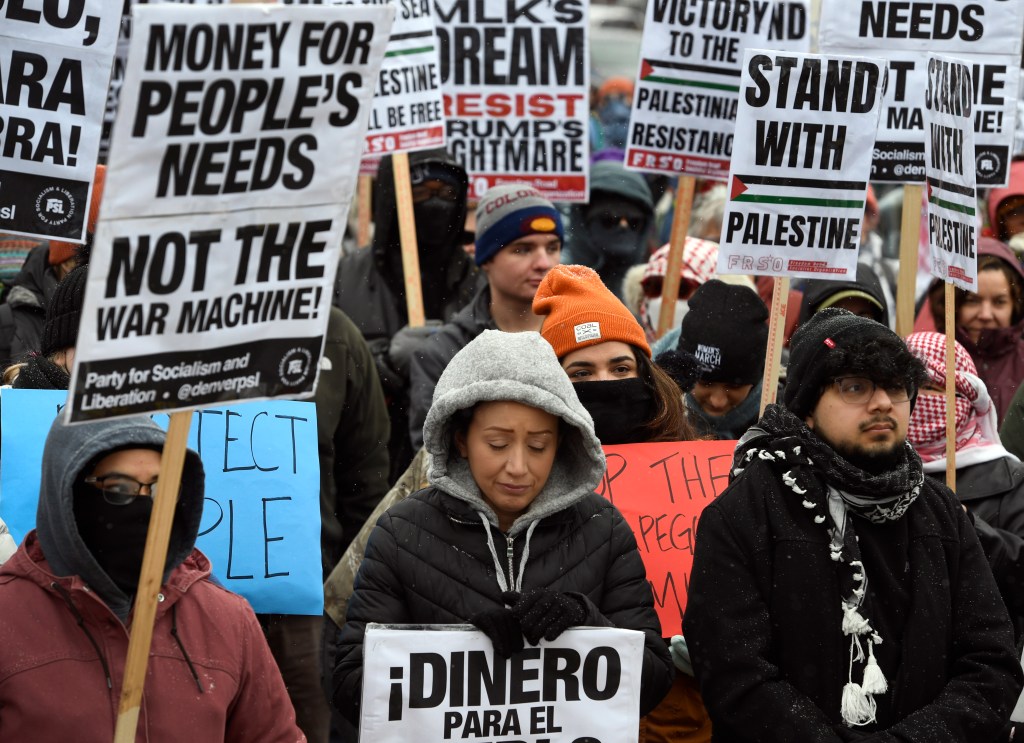 Hundreds rally against Trump's deportation plans in north Aurora