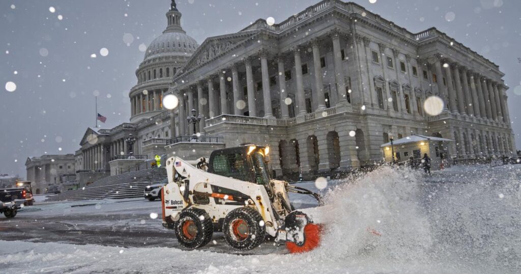 Major winter blast shuts down U.S. schools and government offices