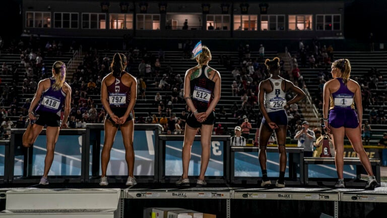 A transgender sprinter wears a trans flag in her hair at the 2024 NCAA Division III outdoor track and field championships.