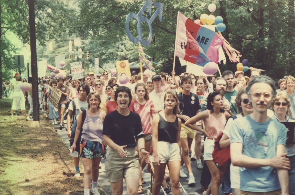 A scene from Durham’s first Pride march in 1986. Photo courtesy of the Durham County Library (Meredith Emmett Papers, LGBTQ Collection, North Carolina Collection, Durham County Library: https://durhamlgbtqhistory.org/exhibit/decade/the-1980s.html).