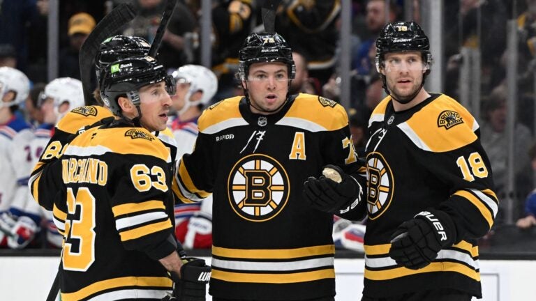 BOSTON, MASSACHUSETTS - FEBRUARY 01: Charlie McAvoy #73 of the Boston Bruins reacts after scoring a goal against the New York Rangers during the first period at the TD Garden on February 01, 2025 in Boston, Massachusetts.
