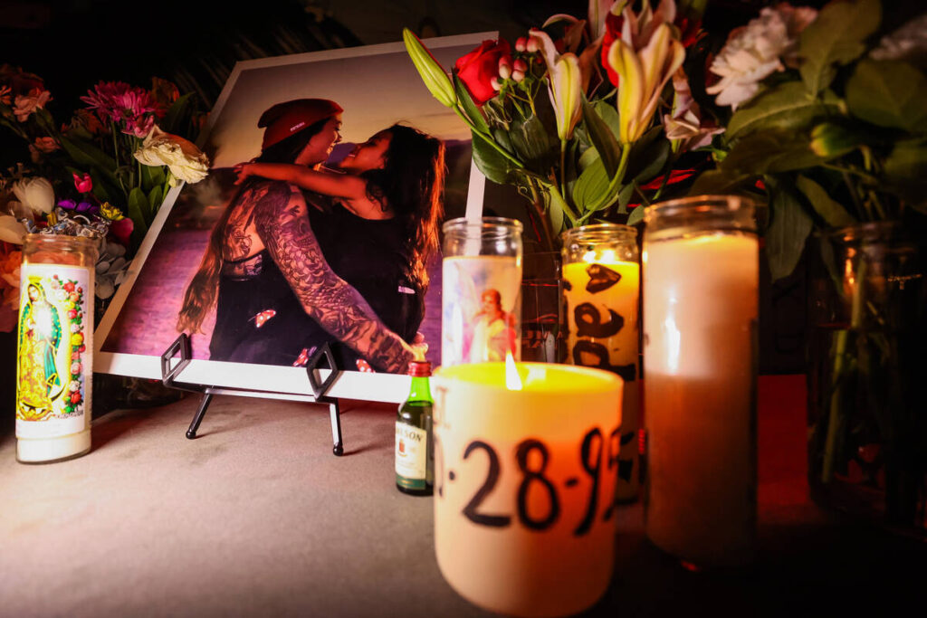 Flowers and candles are left out during a fundraiser in memory of Hope Ritter, a bartender at A ...