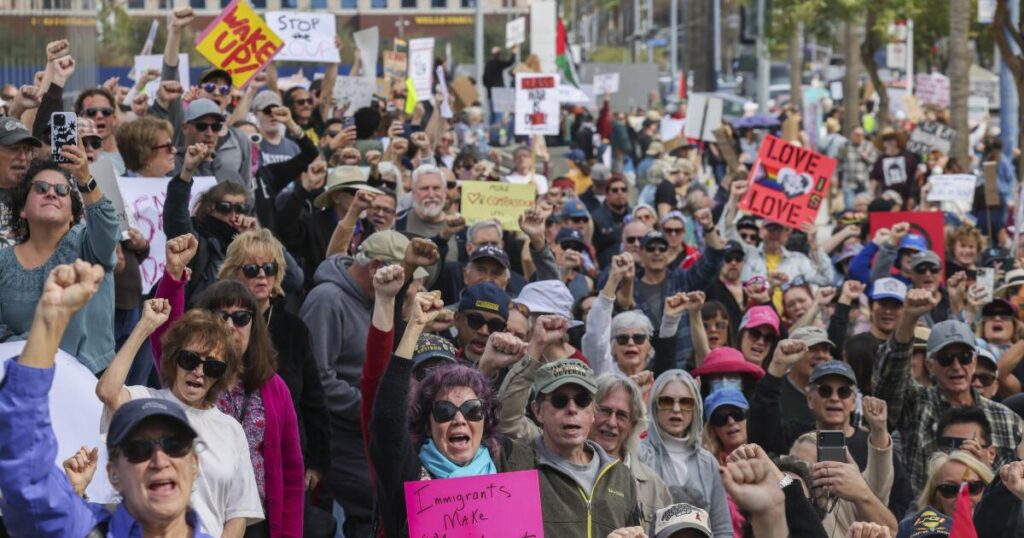 Hundreds rally in Long Beach to protest President Trump and Elon Musk