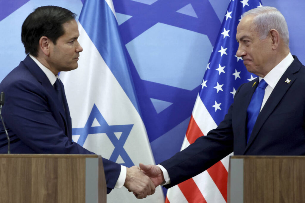 U.S. Secretary of State Marco Rubio, left, and Israeli Prime Minister Benjamin Netanyahu shake ...