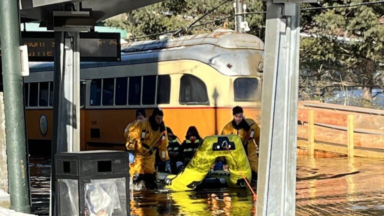 Milton fire officials rescued a Mattapan Line trolley's operator and passengers from flooding Tuesday morning.