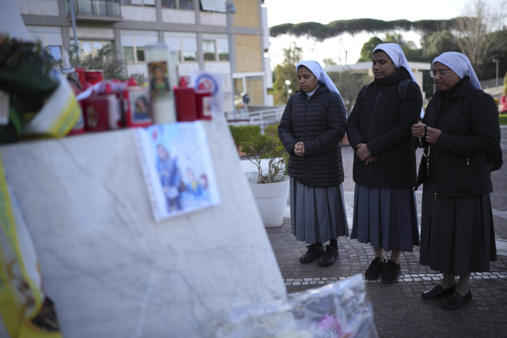 Nuns pray at the Agostino Gemelli Polyclinic, in Rome, Friday, Feb. 28, 2025 where Pope Francis ...