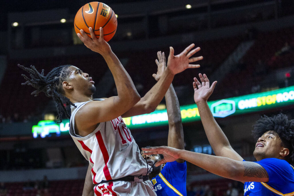 UNLV guard Jaden Henley (10) shoots over San Jose State Spartans guard Josh Uduje (9) and cente ...