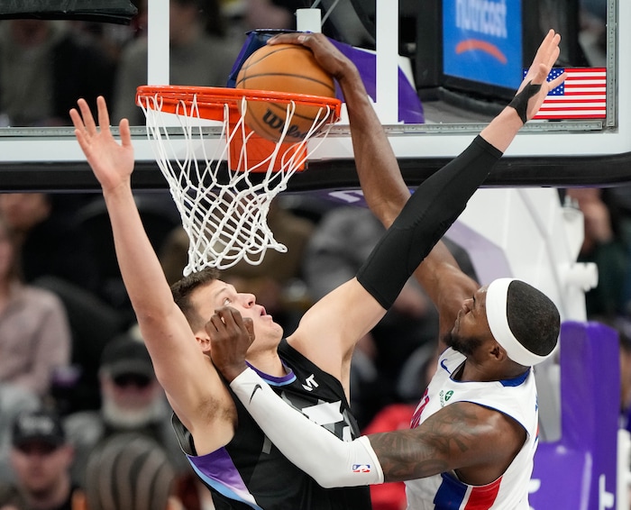 (Francisco Kjolseth  | The Salt Lake Tribune) Detroit Pistons forward Paul Reed (7) makes the dunk past Utah Jazz center Walker Kessler (24) during an NBA basketball game, Monday, March 3, 2025.