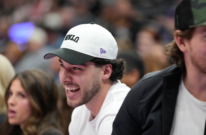 (Francisco Kjolseth  | The Salt Lake Tribune) Sean Durzi of the Utah Hockey Club joins teammates on the court of a Utah Jazz game against the Detroit Pistons, Monday, March 3, 2025.