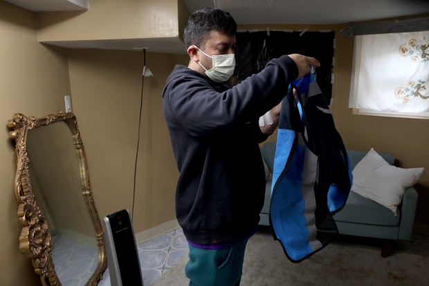 After receiving dialysis, Alfredo Pacheco prepares to go to work...