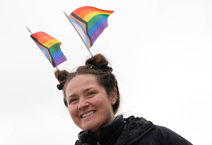 (Francisco Kjolseth  | The Salt Lake Tribune) Emily Draper joins hundreds of people gathered at the Utah State Capitol on Mar. 29, 2025 to fly the largest transgender pride flag in Utah. The unveiling of the flag is part of celebrations for Transgender Day of Visibility, hosted by local nonprofits Utah Pride Center and The Glitter Foundation.