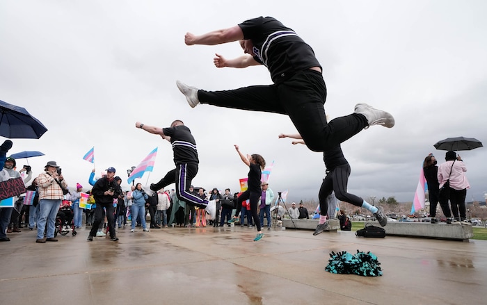 (Francisco Kjolseth  | The Salt Lake Tribune) Cheer Salt Lake celebrates as hundreds of people show up at the Utah State Capitol on Mar. 29, 2025 to fly the largest transgender pride flag in Utah. The unveiling of the flag is part of celebrations for Transgender Day of Visibility, hosted by local nonprofits Utah Pride Center and The Glitter Foundation.