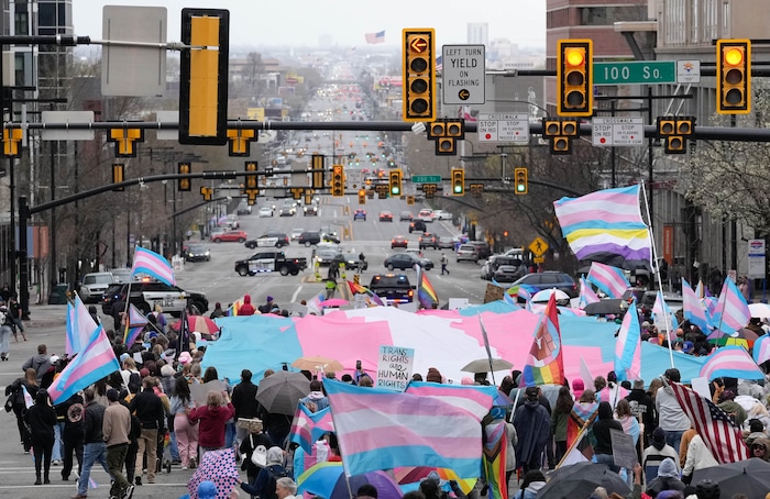 (Francisco Kjolseth  | The Salt Lake Tribune) Hundreds of people show up at the Utah State Capitol on Mar. 29, 2025 to fly the largest transgender pride flag in Utah. The unveiling of the flag is part of celebrations for Transgender Day of Visibility, hosted by local nonprofits Utah Pride Center and The Glitter Foundation.