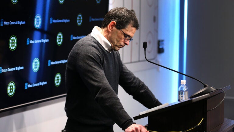 The Boston Bruins held practice at Warrior Ice Arena under their new coach, Joe Sacco after Jim Montgomery was fired as the head coach. Don Sweeney listens to a reporter’s question at a press conference after practice.
