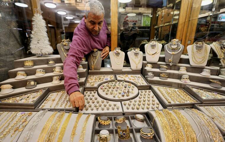 Gold hits record high on safe-haven demand