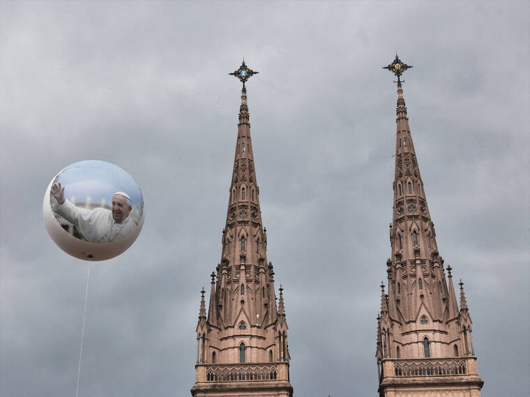 REUTERS/MARTIN COSSARINI
                                A drone view shows a balloon with the image of Pope Francis and the Lujan basilica during a Mass for the recovery of Pope Francis health, in Buenos Aires, Argentina.