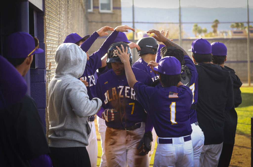 Durango's Alexander Mercurius (7) celebrates his run with teammates during a baseball game agai ...