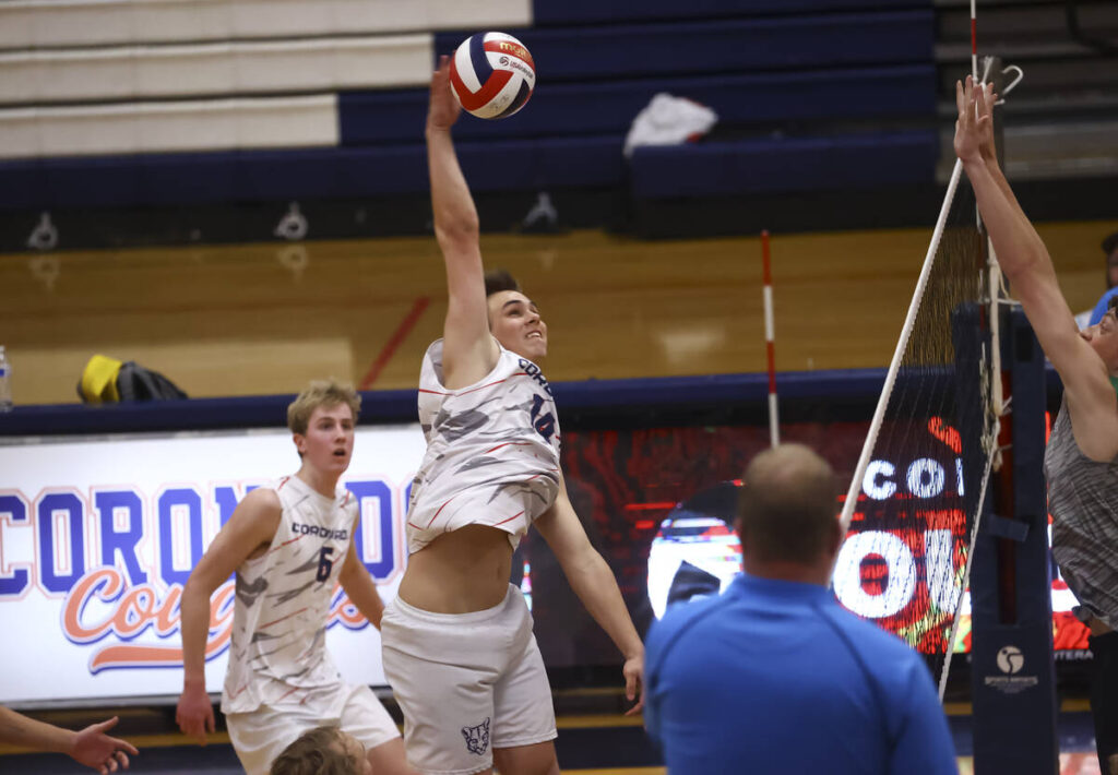 Coronado's Luke Wilkinson spikes the ball against Palo Verde during a high school volleyball ga ...