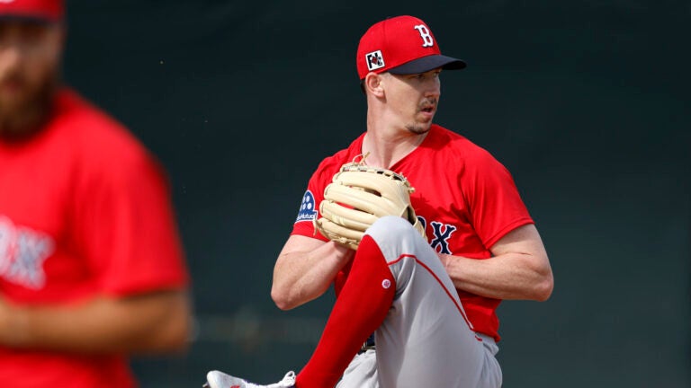 Boston Red Sox pitcher Walker Buehler (right) throws during spring training at JetBlue Park.