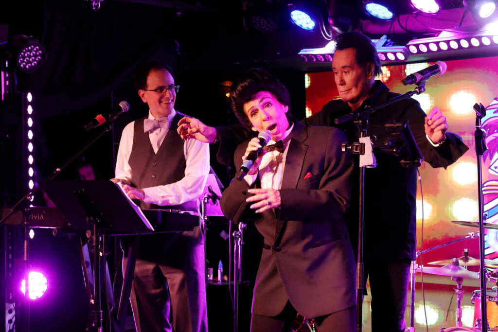 Kelly Clinton-Holmes does a Wayne Newton impression as Mr. Las Vegas himself sneaks up on her d ...
