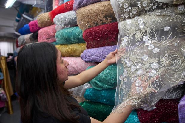A hand-embroidery dress fabric made in India is sold at the Francia Textiles fabric store in the Fashion District in Los Angeles