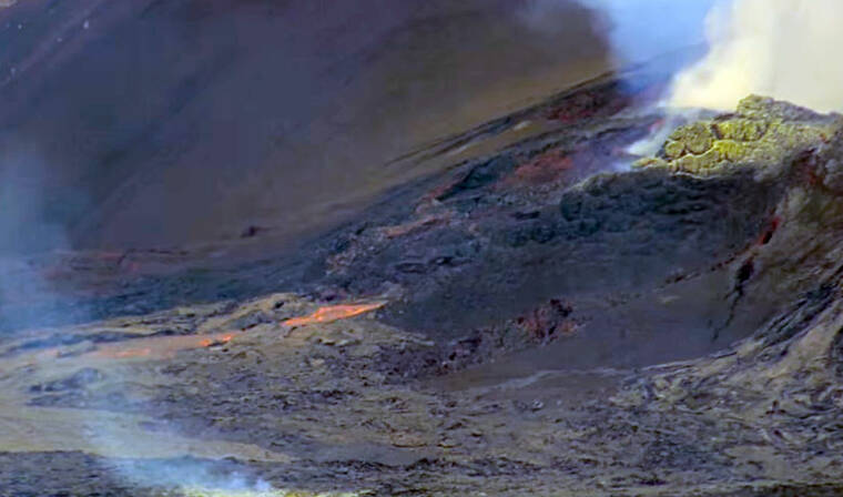 COURTESY U.S. GEOLOGICAL SURVEY
The view of the Halemaumau crater from the eastern rim of the caldera showing lava flowing onto the crater floor.