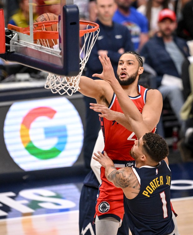 Ben Simmons (25) of the LA Clippers finishes over Michael...
