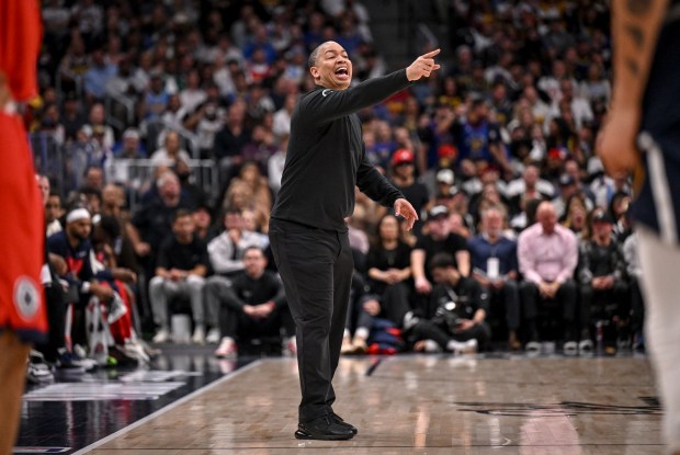 Head coach Ty Lue of the LA Clippers works against...