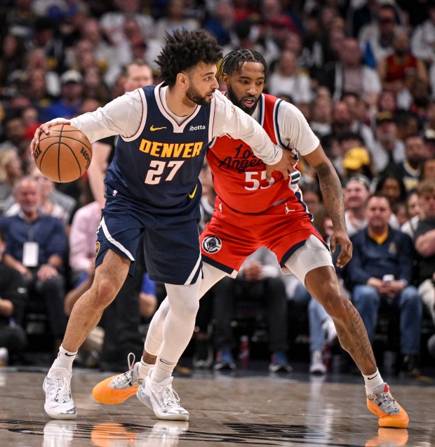 Jamal Murray (27) of the Denver Nuggets works against Derrick...