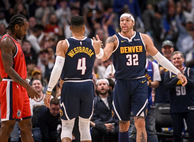 Aaron Gordon (32) of the Denver Nuggets high fives Russell...