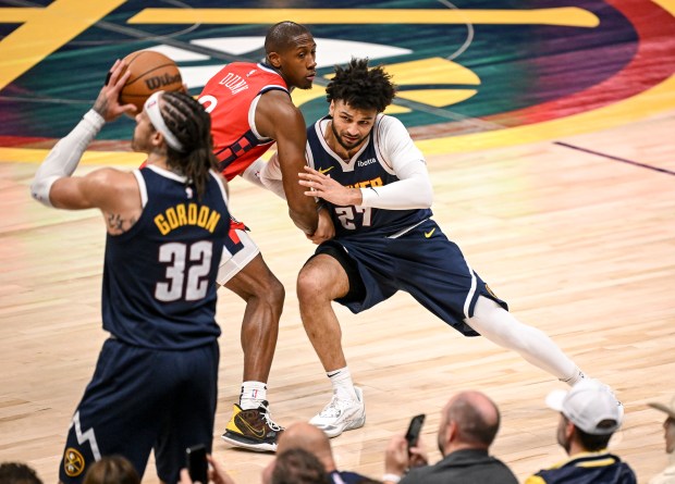 Jamal Murray (27) of the Denver Nuggets battles with Kris...