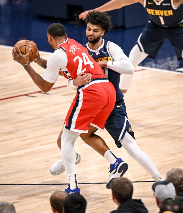 Jamal Murray (27) of the Denver Nuggets wraps up the...