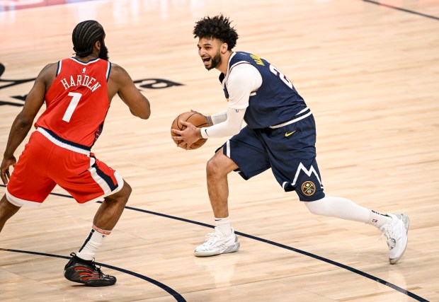 Jamal Murray (27) of the Denver Nuggets works against James...