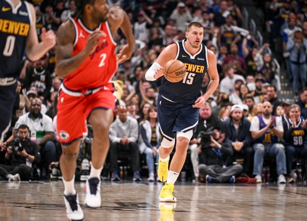 Nikola Jokic (15) of the Denver Nuggets runs in transition...