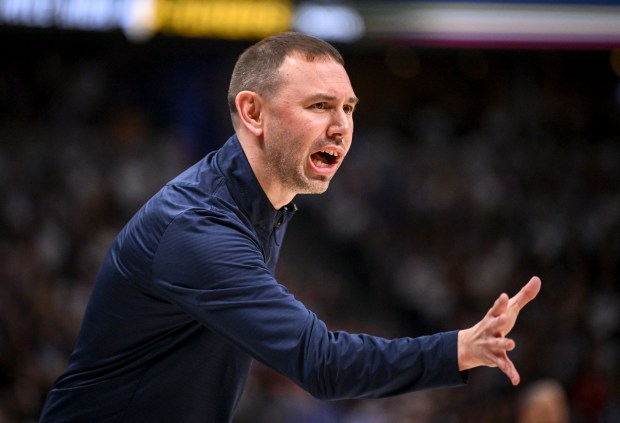 Head coach David Adelman of the Denver Nuggets works agianst...