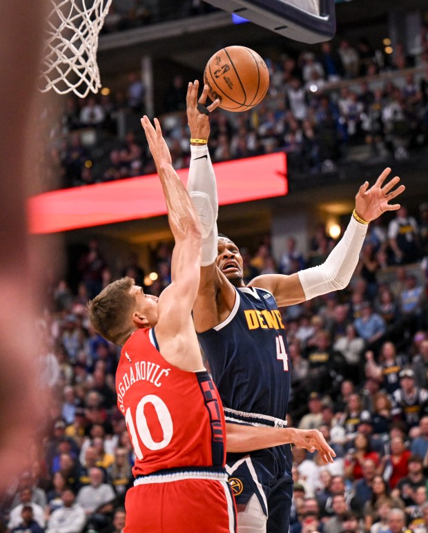 Russell Westbrook (4) of the Denver Nuggets draws a foul...