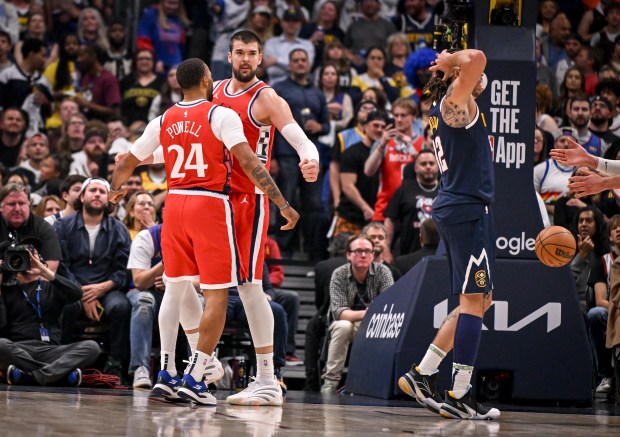 Ivica Zubac (40) of the LA Clippers bumps chests with...