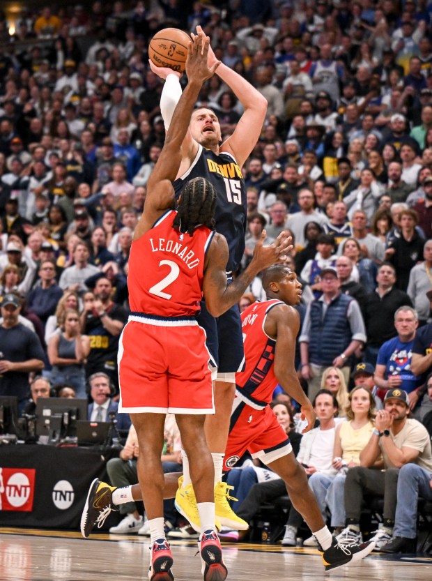 Nikola Jokic (15) of the Denver Nuggets puts up a...