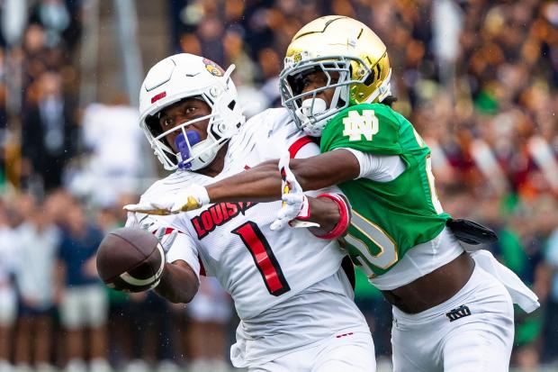 Notre Dame cornerback Benjamin Morrison knocks the ball away from Louisville wide receiver Ja'Corey Brooks on Sept. 28, 2024, in South Bend, Ind. (Michael Caterina/AP)