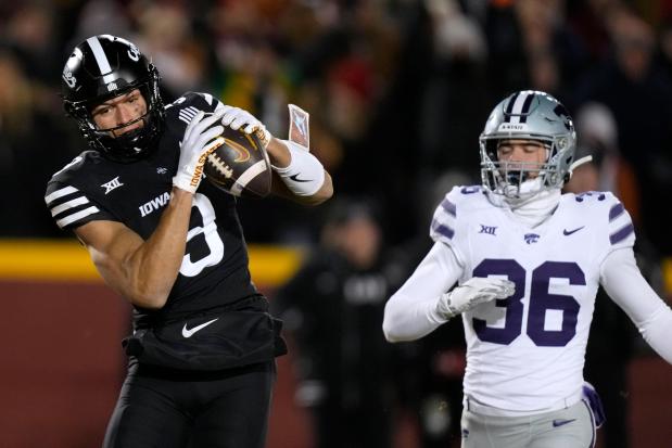 Iowa State wide receiver Jayden Higgins catches a touchdown pass in front of Kansas State safety Jack Fabris on Nov. 30, 2024, in Ames, Iowa. (Charlie Neibergall/AP)