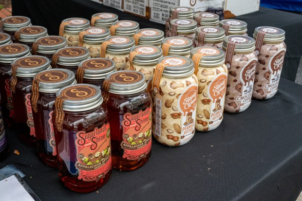 Main Street Liquors in Hampstead offered samples of Sugarlands Shine Appalachian Apple Pie Moonshine, peanut butter flavored Sippin' Cream and chocolate coffee Sippin' Cream during the Westminster Wine Stroll on Main Street. (Karen Jackson/Freelance)