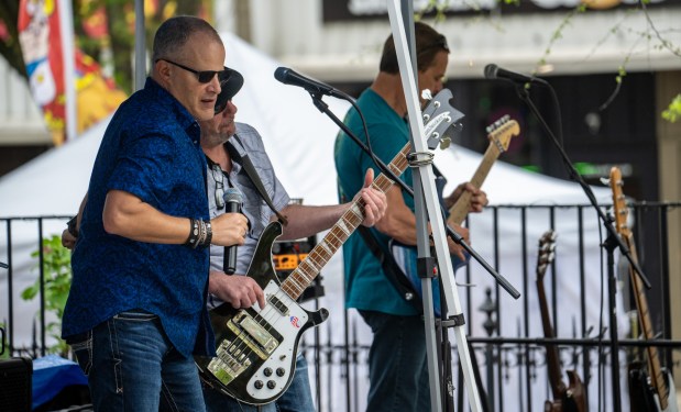 Wierd Science 80s rock band members perform at the library stage during the Westminster Wine Stroll on Main Street. (Karen Jackson/Freelance)